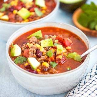 Description: Instant Pot Taco Soup with avocado and tomatoes.
