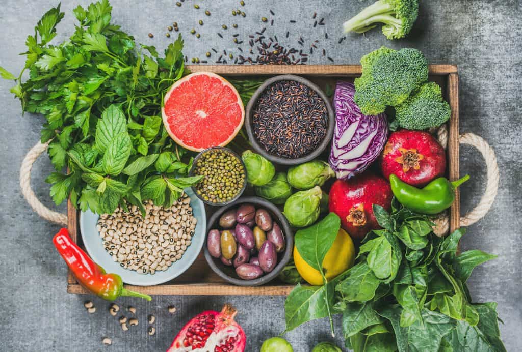 fruit and vegetables on wood board