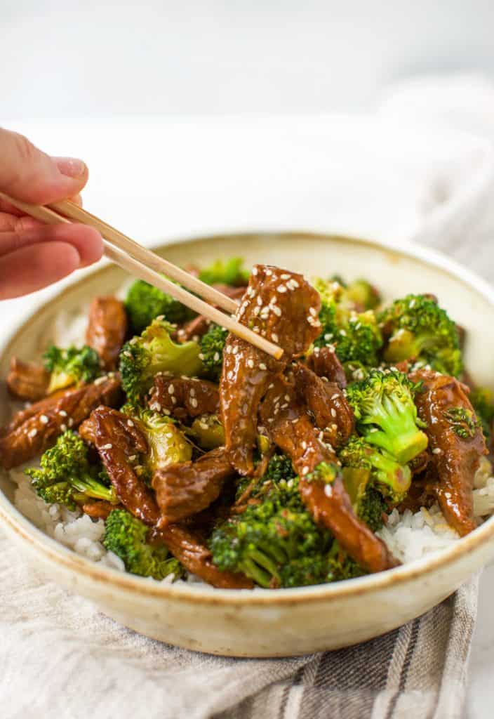 gluten free instant pot beef and broccoli with chopsticks close up