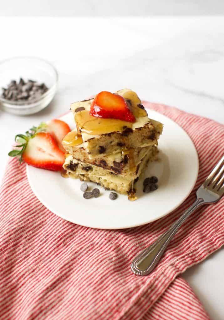 gluten free sheet pan pancakes with syrup and strawberries