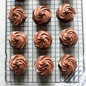 12 chocolate cupcakes on a cooling rack