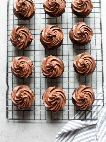 12 chocolate cupcakes on a cooling rack