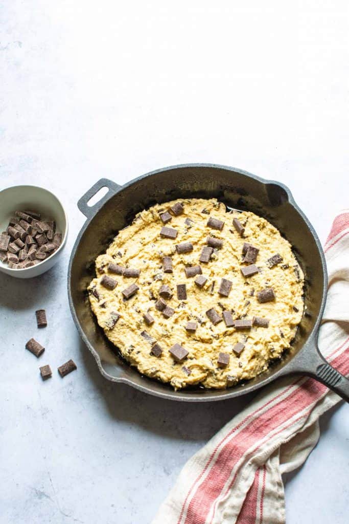 raw chocolate chip cookie dough in a skillet