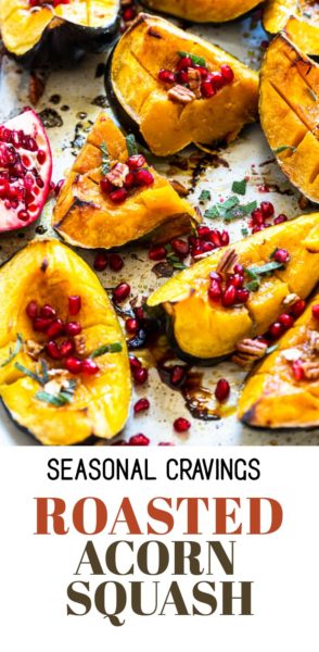 Buttery roasted acorn squash with pomegranate and pomegranate seeds.