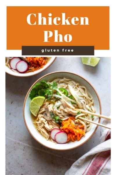 Easy Chicken Pho served in two bowls on a white background.