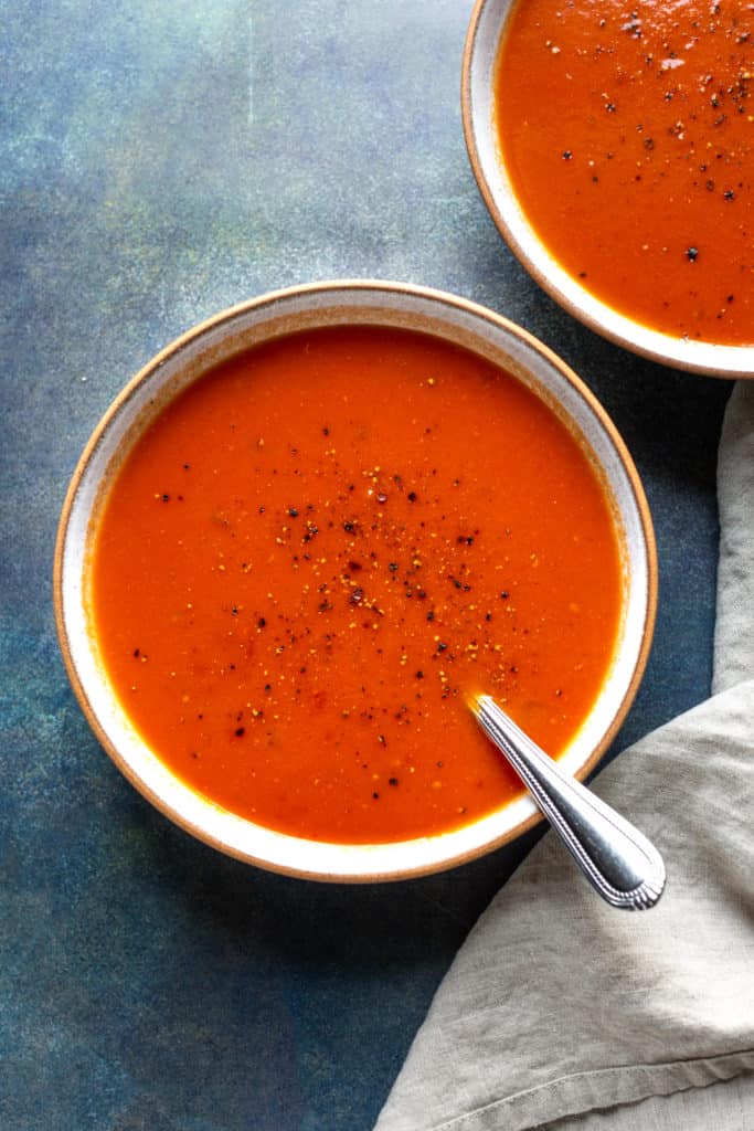 spicy tomato soup in a bowl with a spoon