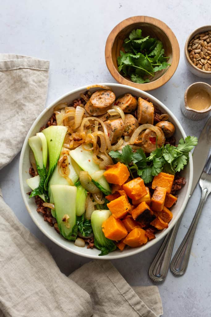 sausage and butternut squash bowl with bok choy and herbs