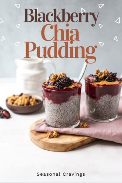 Blackberry chia pudding with peanut butter on a wooden board.