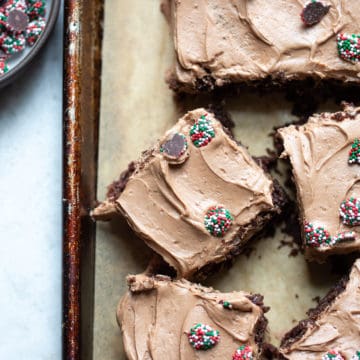 Gluten Free Chocolate fudge bars on a baking sheet with sprinkles.