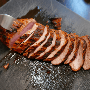 baked pork tenderloin sliced