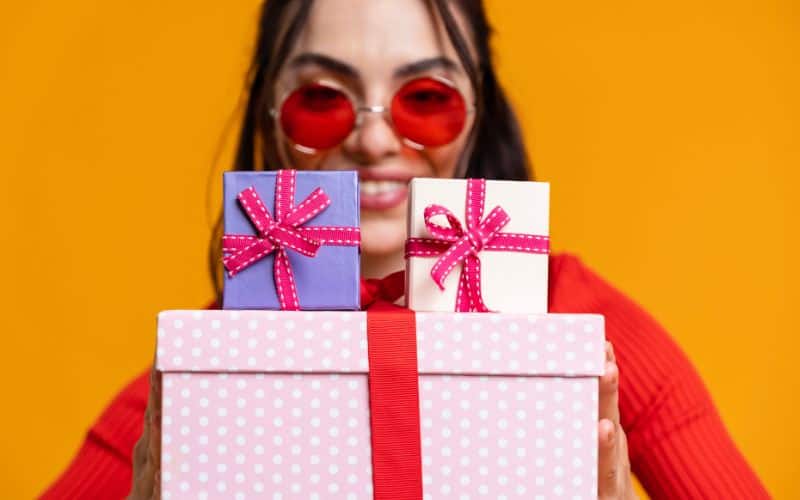 woman with stack of gifts