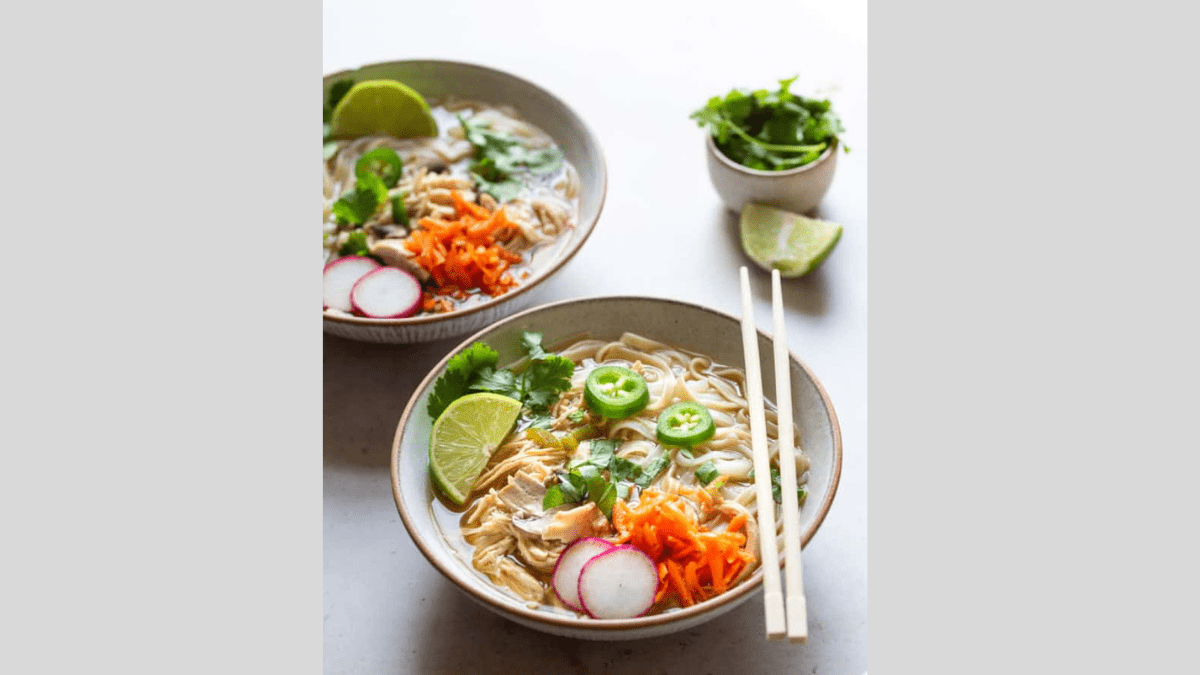 Chicken Pho in a bowl with chopsticks