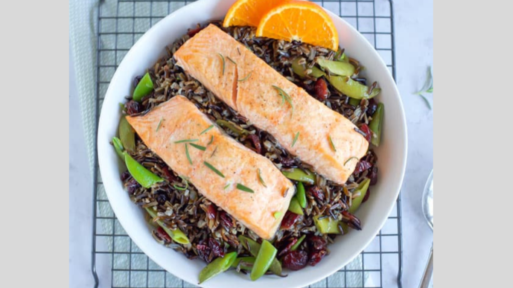 baked salmon with black rice in a bowl