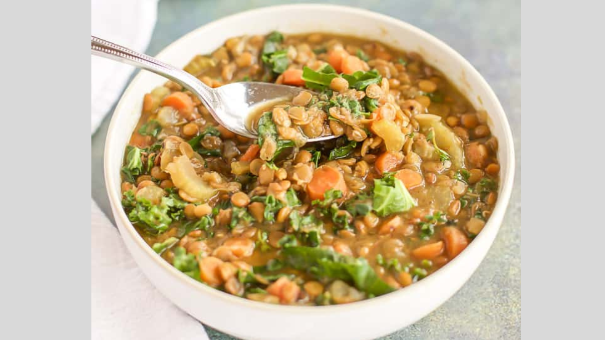 instant pot lentil soup with a spoon