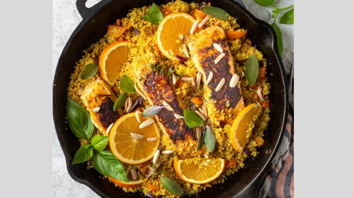 turmeric salmon and couscous in a pan