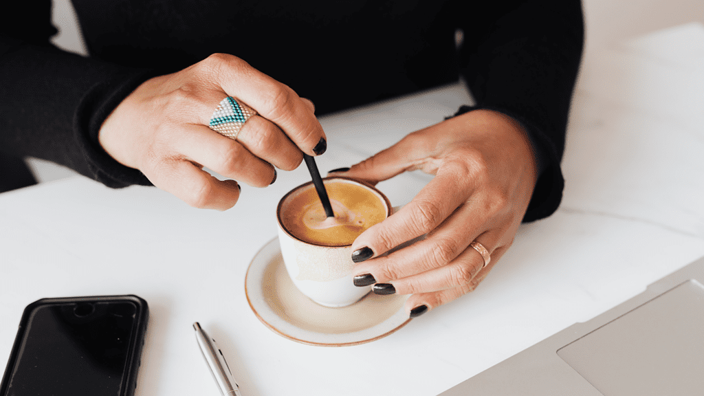 woman stirring espresso