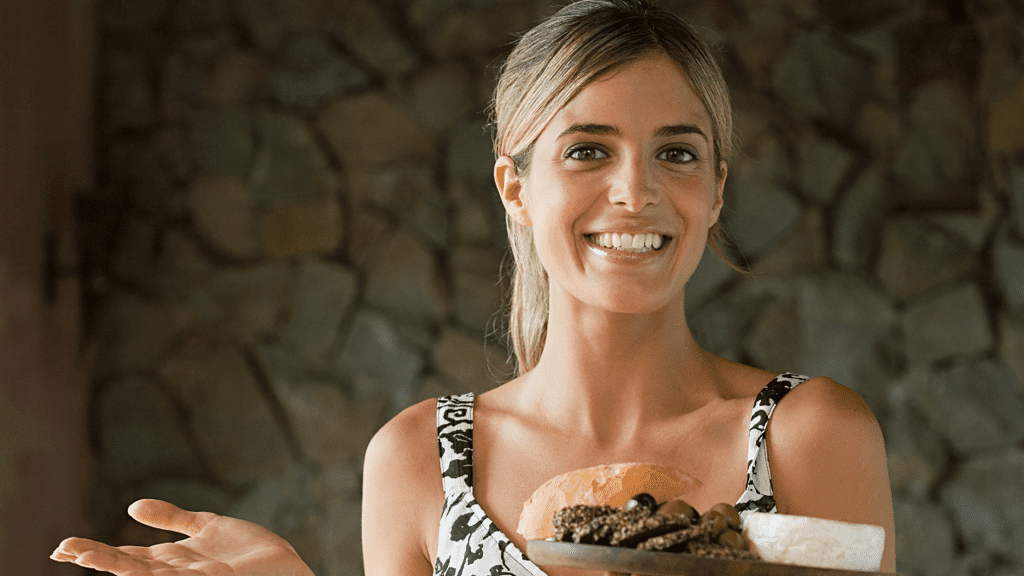 woman holding mediterranean food