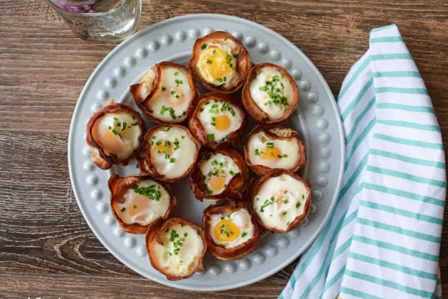 Bacon and Egg Cups on a round plate.