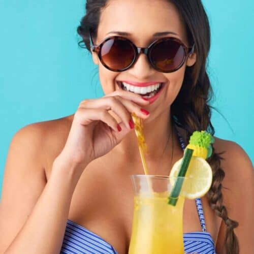 Woman with tropical cocktail