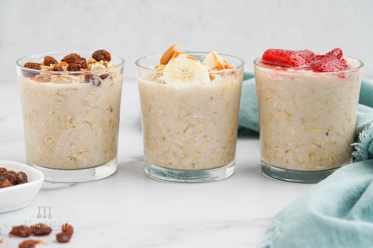 Three glasses of Protein Overnight Oats with different toppings.