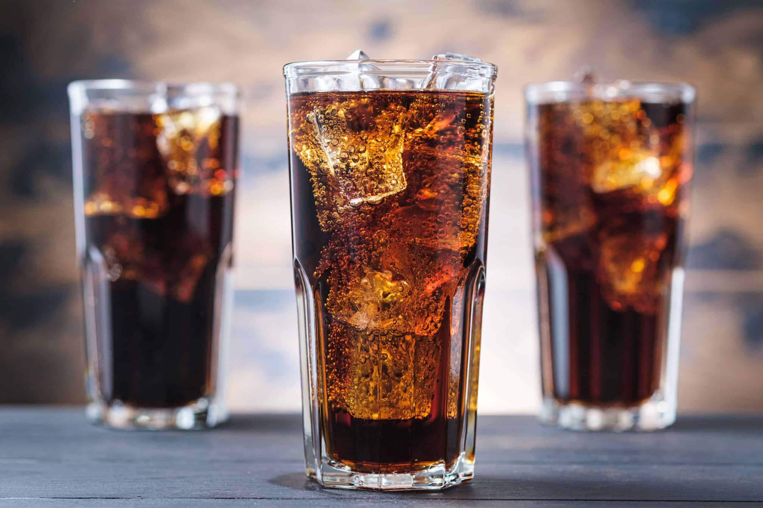 three glasses of soda