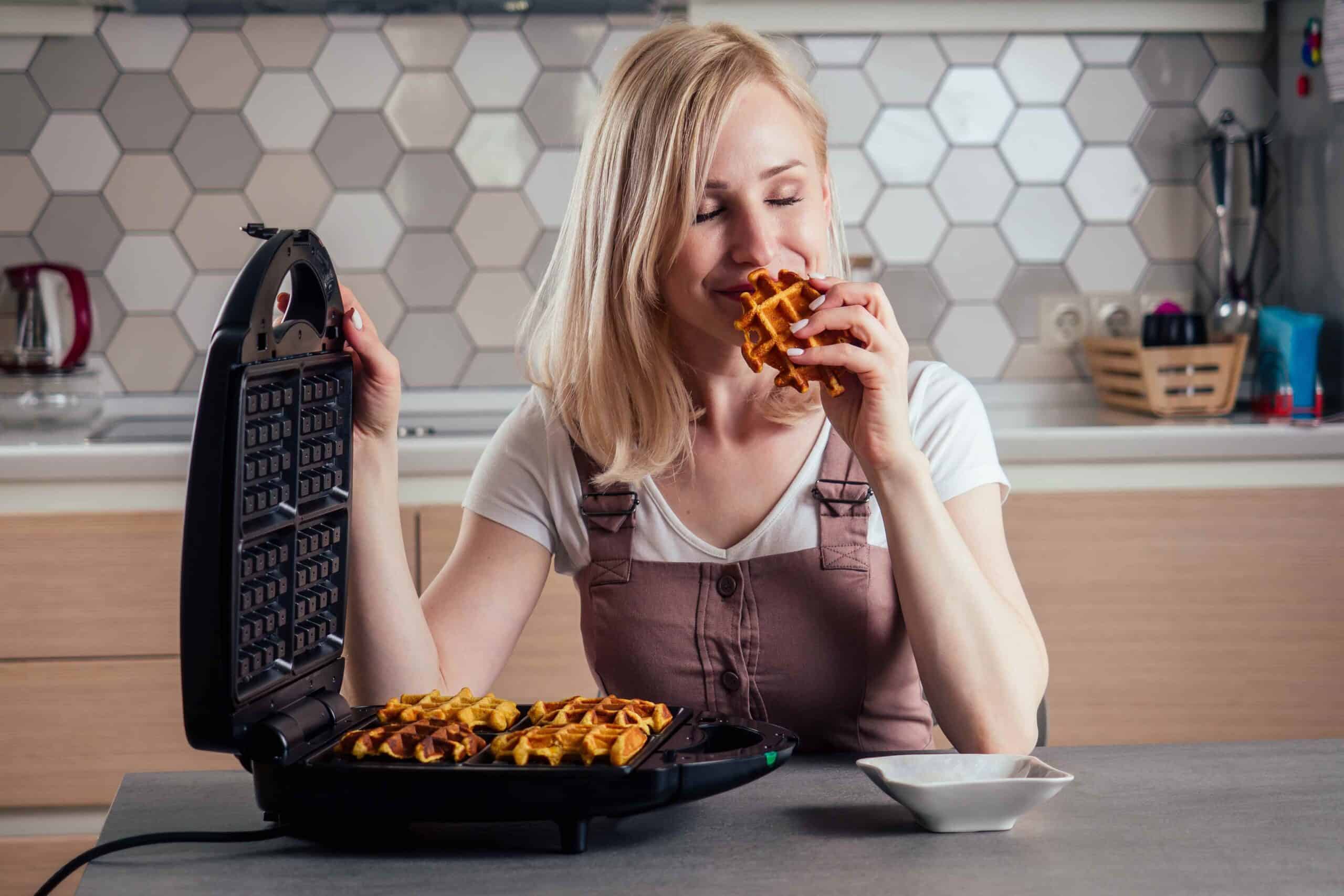 woman with a waffle iron