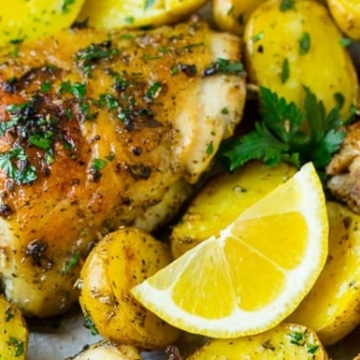 15 Sheet Pan Chicken Dinners featuring Roasted chicken with lemon and potatoes on a baking sheet.