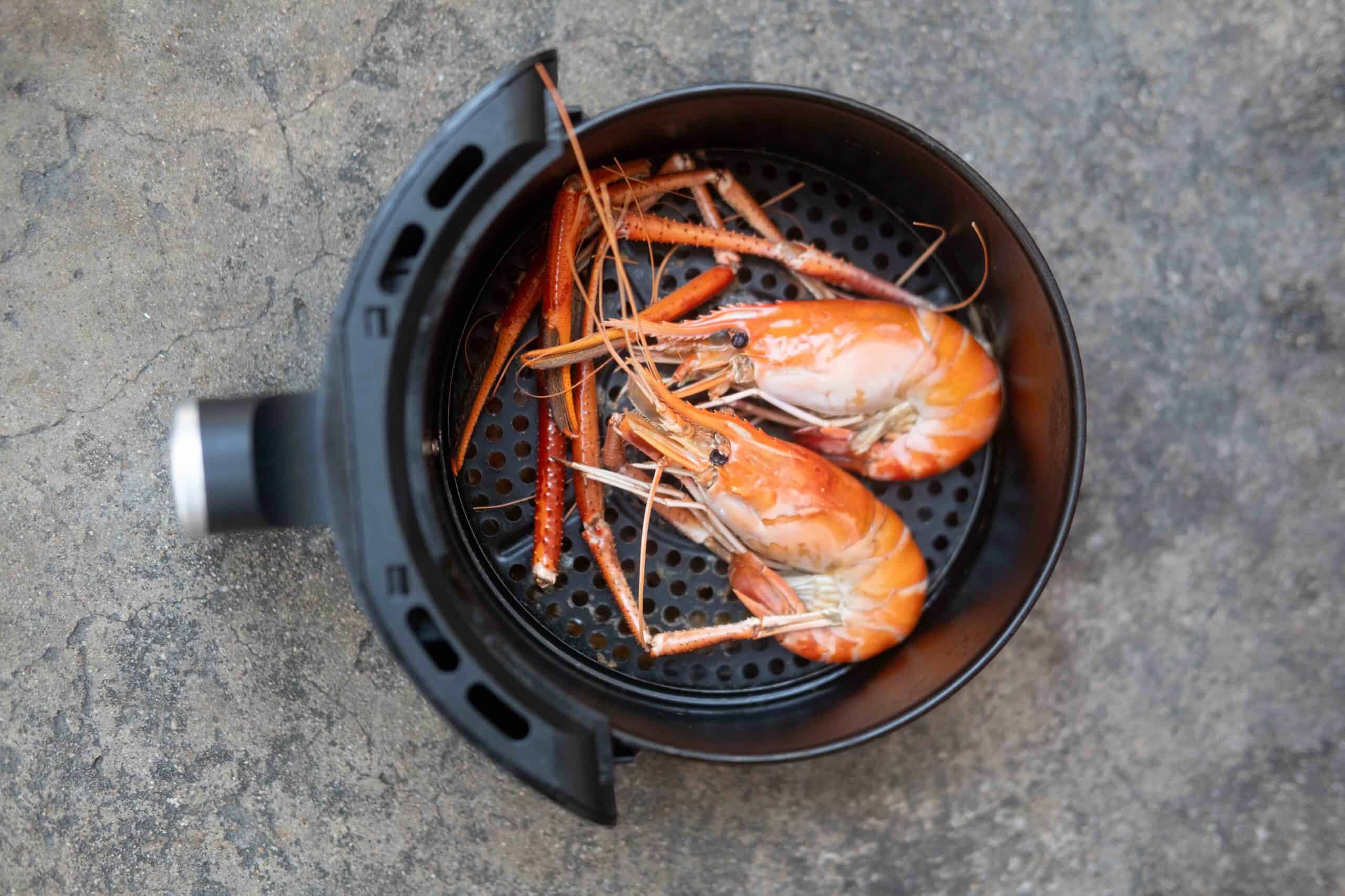 River shrimp cooked in black air fryer. Easy cooking in house concept