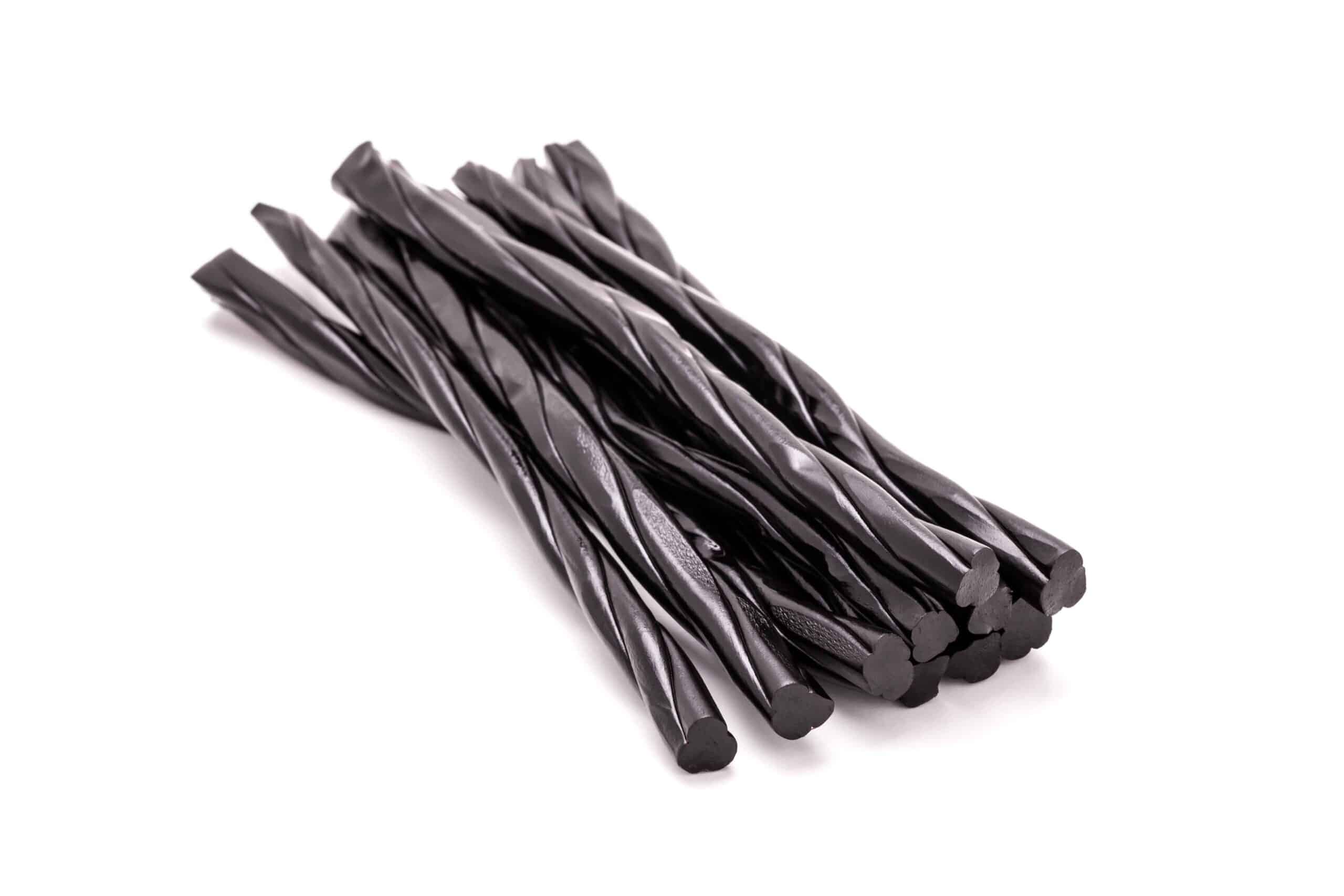 Licorice sticks on white background.