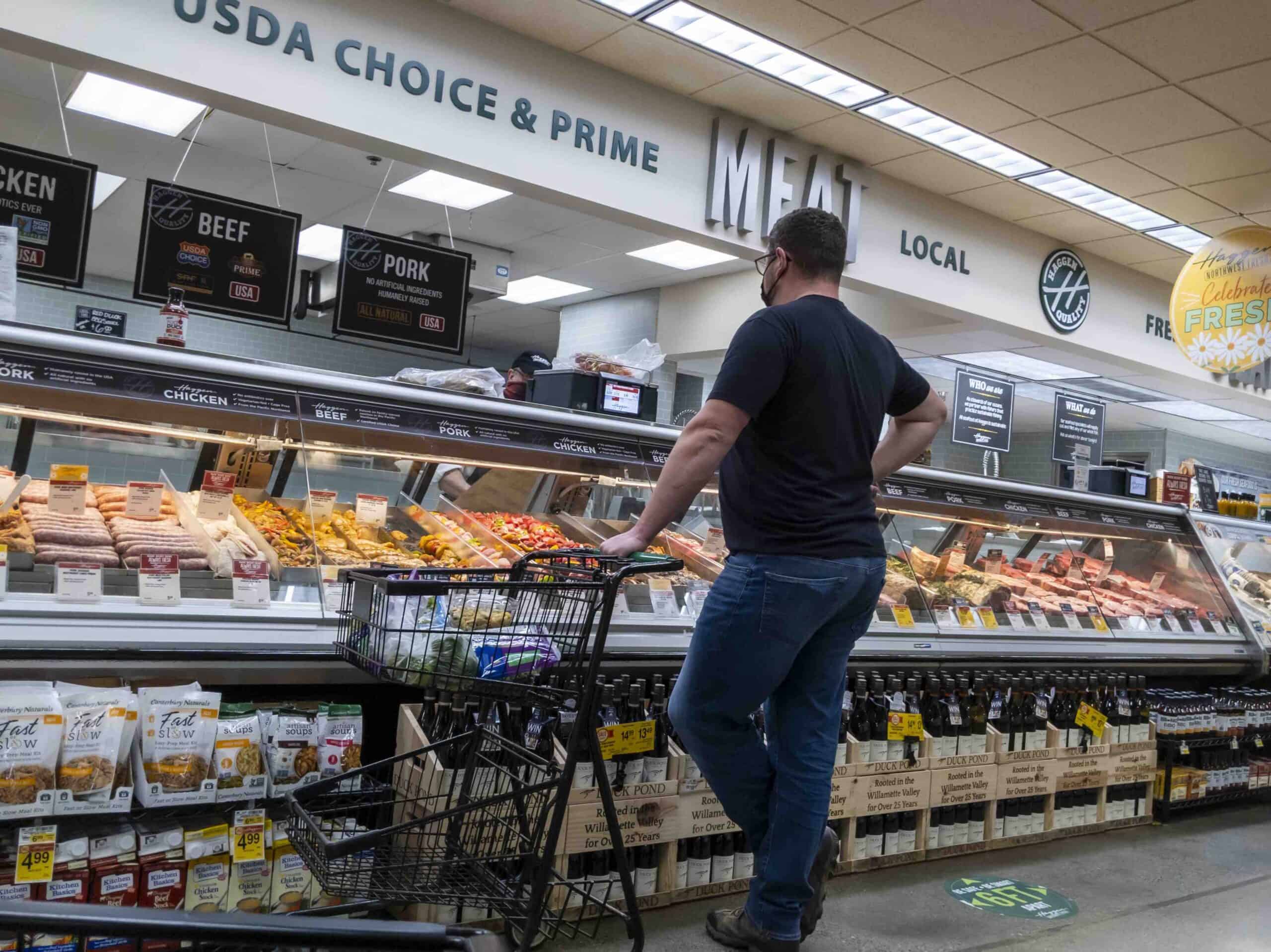 Man shopping at the meat and deli department at Haggen grocery store.