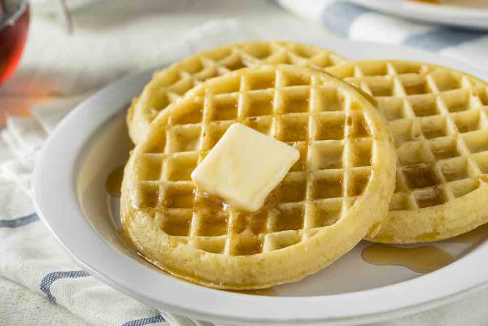 Brown Hot Freezer Waffles with Butter and Maple Syrup