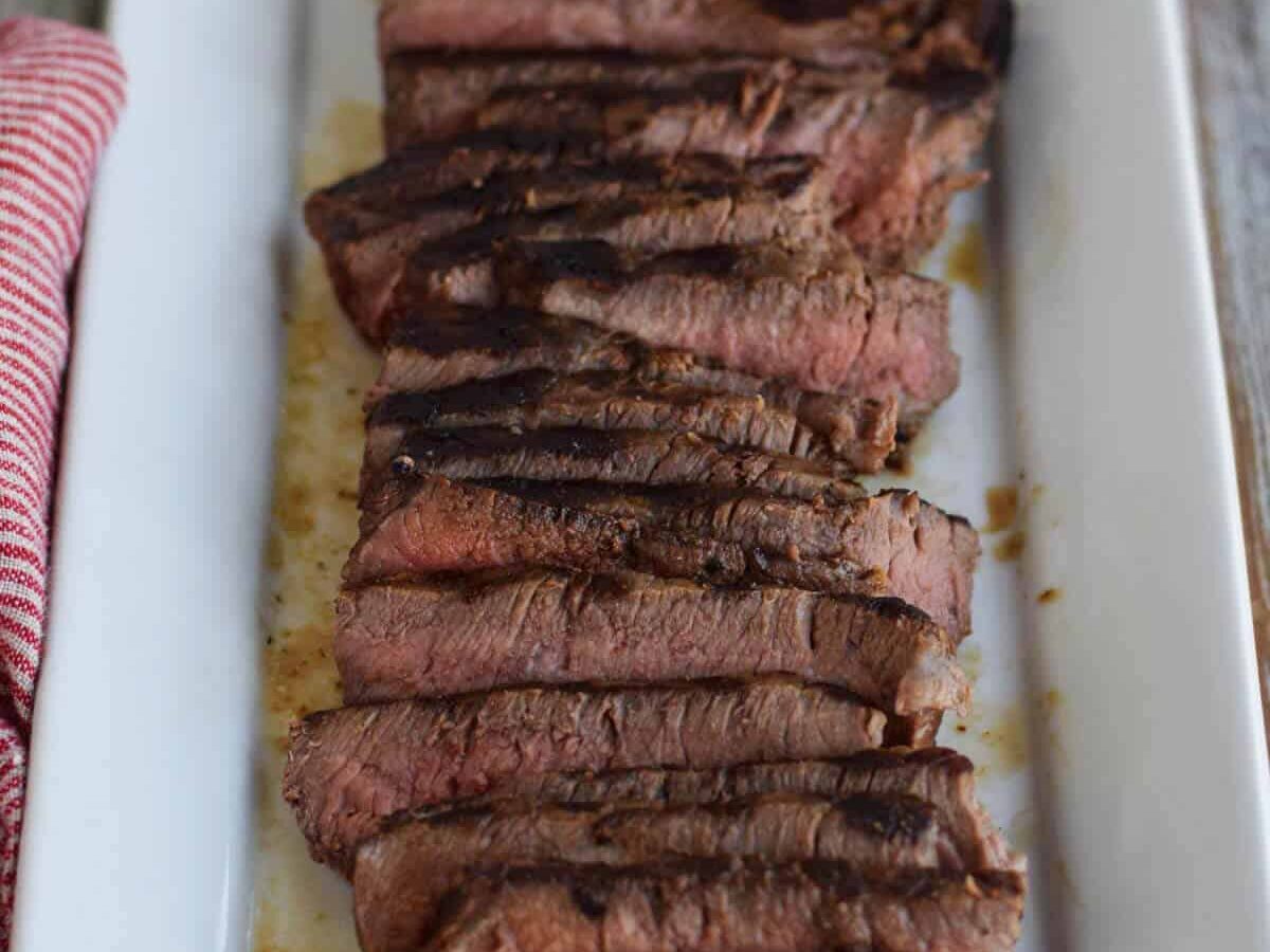 London broil on a white tray.