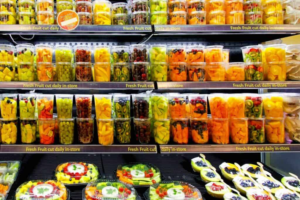 Big shelf in supermarket with fresh fruits