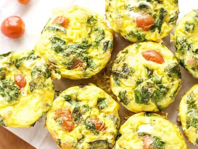 Quiche Cups with Kale and Prosciutto on a cutting board