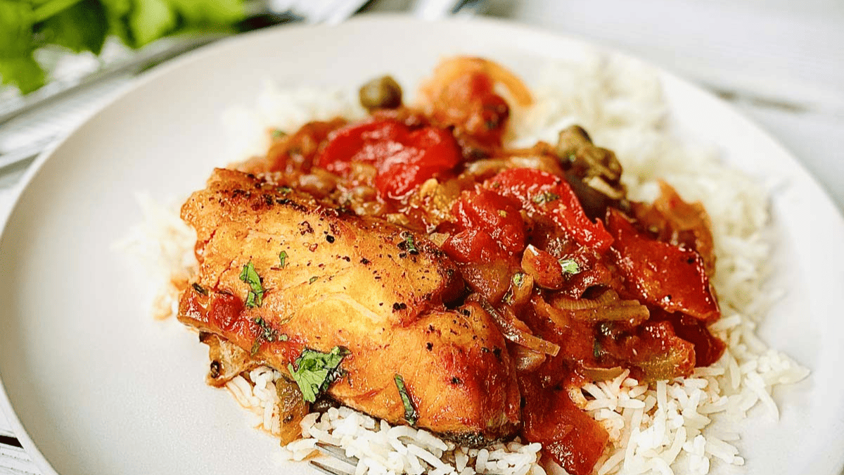Baked cod with capers and tomato sauce.