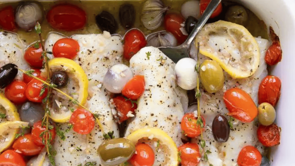 Lemon baked cod with tomatoes and olives.