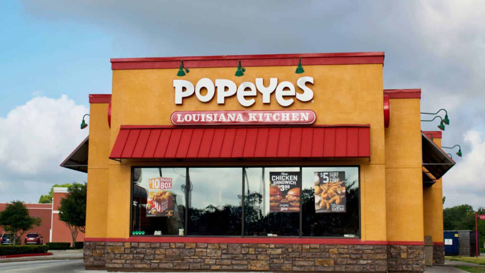 Houston, Texas USA 08-14-2019: Popeye's fried chicken storefront in Houston, TX. Popular Southern fast food restaurant founded in 1972.
