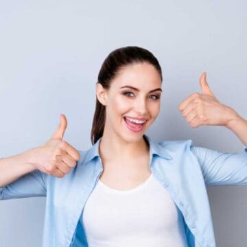 Woman showing thumbs up