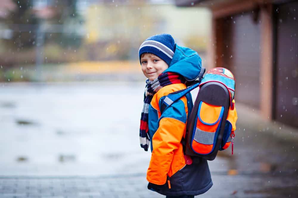kid walking to school in snow