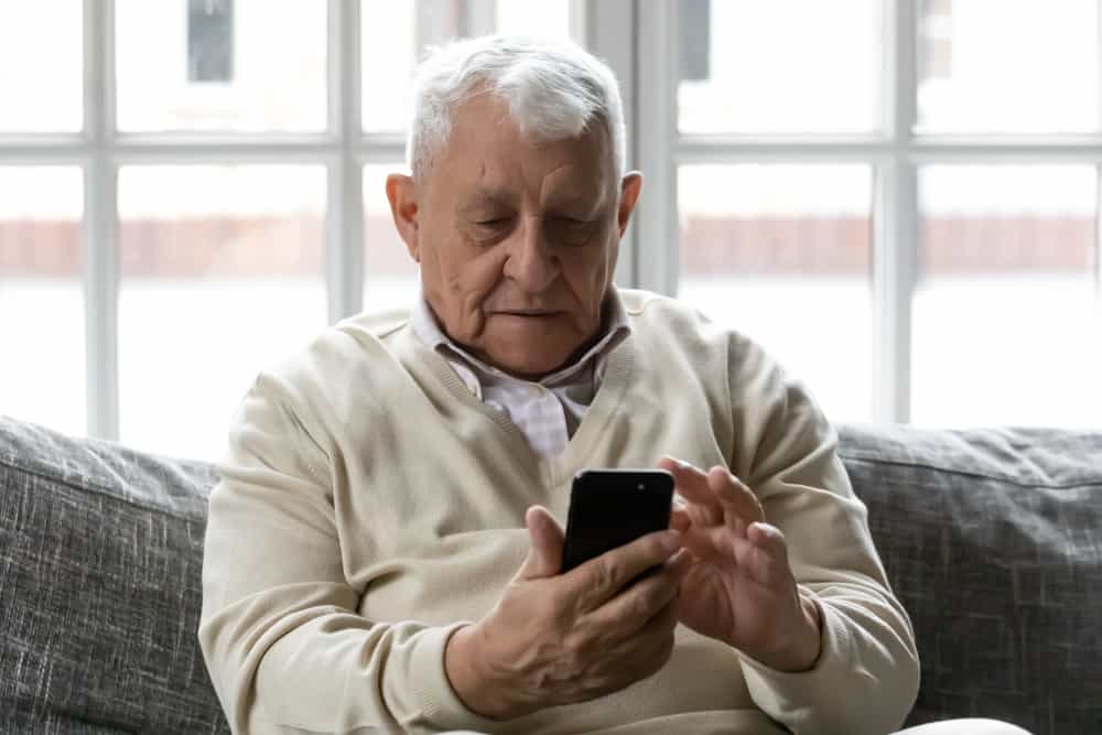 older man texting