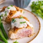 A plate with ham and green beans on it, served alongside 30 Air Fryer Chicken Recipes.