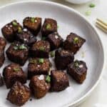 46 Gluten Free Appetizers featuring grilled tofu on a plate with green onions.
