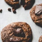 40 Gluten Free Chocolate Cookies with a bite taken out of them.