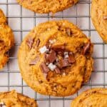 Gluten-free pumpkin chocolate chip cookies on a cooling rack.