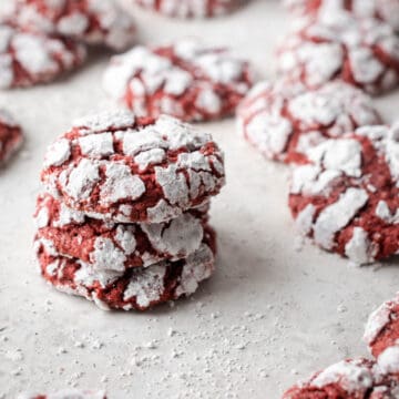 Gluten Free Red Velvet Crinkle Cookies with powdered sugar.
