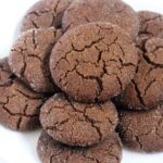 40 gluten free chocolate cookies on a white background.