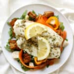 A plate of fish and vegetables on a white cloth, perfect for 50 Easy Gluten Free Dinners.