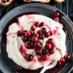 Cranberry cream cheese with gluten-free crackers on a plate.