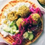 A plate of falafel and a bowl of gluten-free salad.