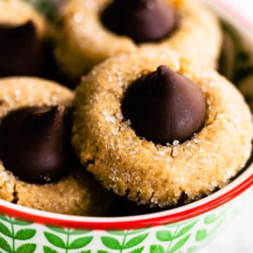 40 gluten free chocolate peanut butter cookies in a green bowl.